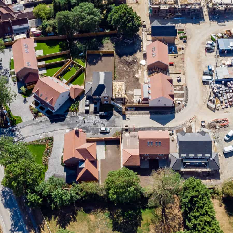 Aerial view of small residential housing development.