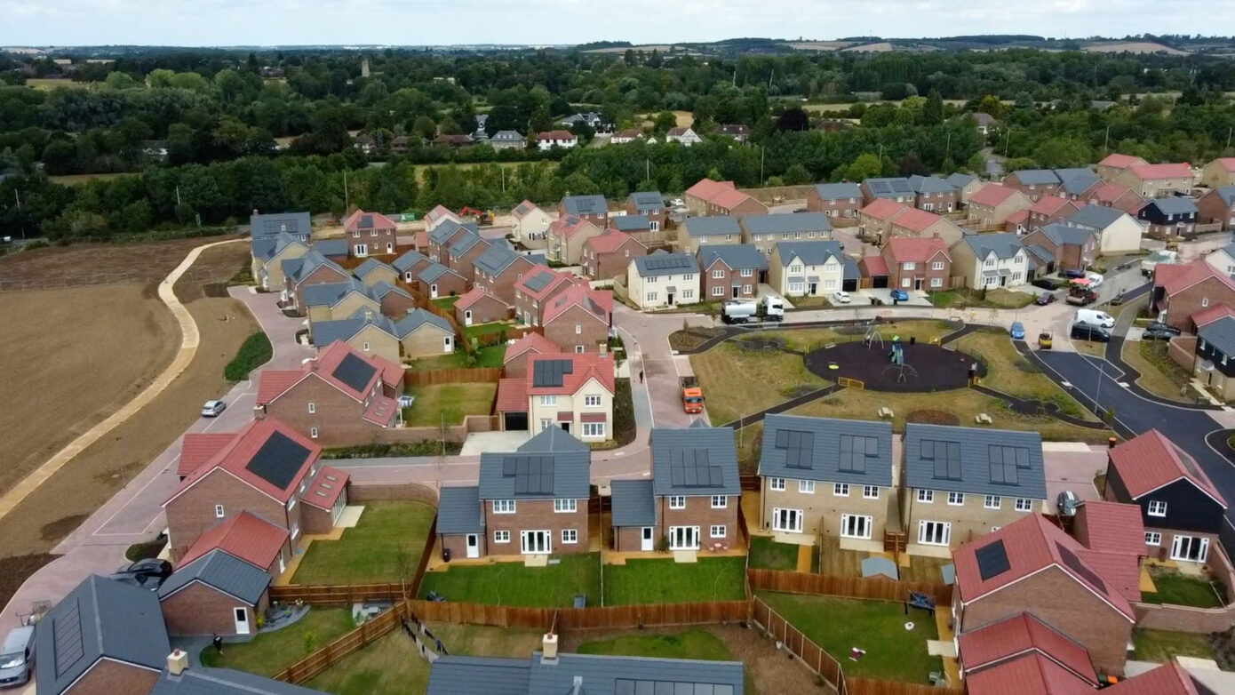Aerial view of modern housing estate with playground.