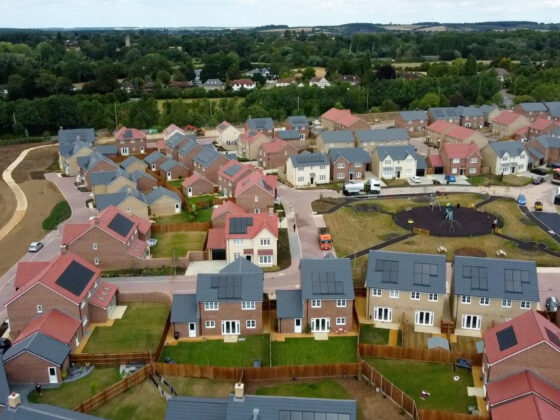 Aerial view of modern housing estate with playground.