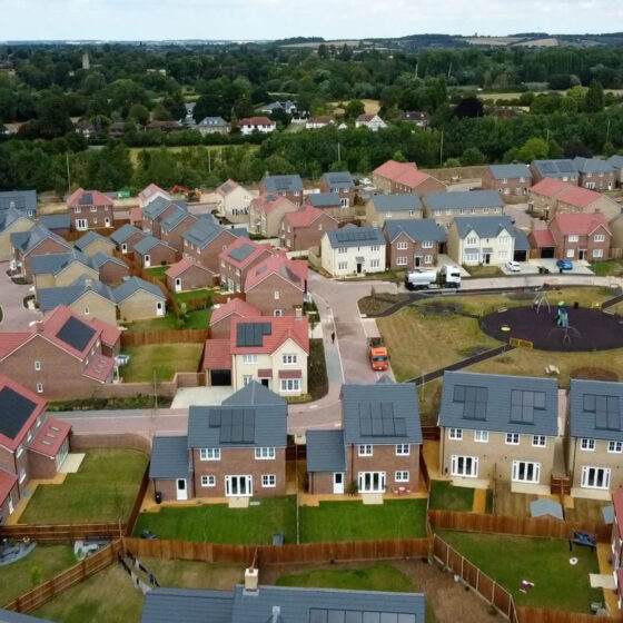 Aerial view of modern housing estate with playground.