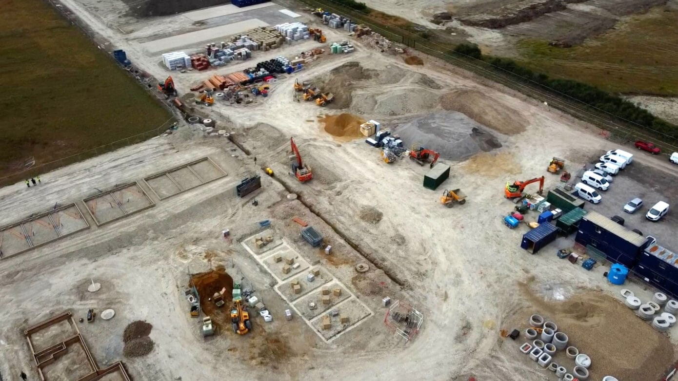 Aerial view of active construction site with machinery.