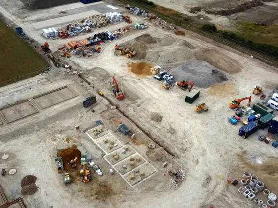 Aerial view of active construction site with machinery.