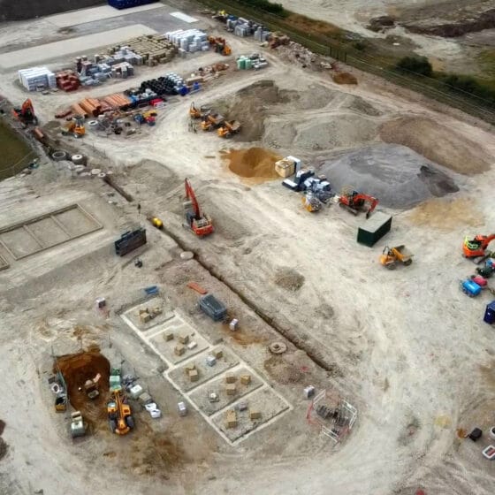 Aerial view of active construction site with machinery.